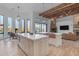 Open concept kitchen with island, copper sink, and wood beams at 14236 E Ranch Rd, Scottsdale, AZ 85262