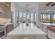 Spacious kitchen with island, stainless steel appliances, and stunning views at 14236 E Ranch Rd, Scottsdale, AZ 85262