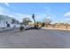 Landscaped yard featuring desert plants and a white home at 14236 E Ranch Rd, Scottsdale, AZ 85262