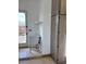 Bright laundry room features ample storage, utility sink, and access to the outdoors at 14236 E Ranch Rd, Scottsdale, AZ 85262