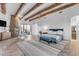 Spacious main bedroom with fireplace, sitting area, and wood beams at 14236 E Ranch Rd, Scottsdale, AZ 85262