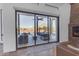 View of backyard patio with seating area through sliding glass doors at 14236 E Ranch Rd, Scottsdale, AZ 85262