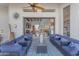 Covered patio with comfortable seating overlooking the living room at 14236 E Ranch Rd, Scottsdale, AZ 85262