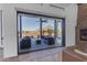 View of backyard patio with seating area through sliding glass doors at 14236 E Ranch Rd, Scottsdale, AZ 85262