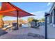 Relaxing pool area with lounge chairs and umbrella for shade at 14236 E Ranch Rd, Scottsdale, AZ 85262