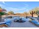Inviting pool with lounge chairs and a desert landscape at 14236 E Ranch Rd, Scottsdale, AZ 85262