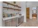 Stylish wet bar with wine cooler and ample storage at 14236 E Ranch Rd, Scottsdale, AZ 85262