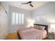 Guest bedroom with a queen-size bed and window shutters at 15720 E Yucca Dr, Fountain Hills, AZ 85268