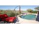 Inviting backyard oasis with a sparkling pool and relaxing lounge chair at 15720 E Yucca Dr, Fountain Hills, AZ 85268