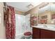 Bathroom with tub, shower, and wood vanity at 1720 E Thunderbird Rd # 2059, Phoenix, AZ 85022