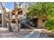 Exterior view of condo building with stairs and landscaping at 1720 E Thunderbird Rd # 2059, Phoenix, AZ 85022