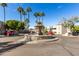 Community courtyard with a central fountain and palm trees at 1720 E Thunderbird Rd # 2059, Phoenix, AZ 85022