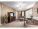 Living room with TV, couch, chair, and decorative pieces at 1720 E Thunderbird Rd # 2059, Phoenix, AZ 85022