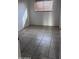 Bedroom with tile flooring and a window with blinds at 18202 N Cave Creek Rd # 128, Phoenix, AZ 85032
