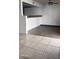 Kitchen features gray cabinets, tile flooring and modern appliances at 18202 N Cave Creek Rd # 128, Phoenix, AZ 85032