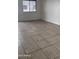 Living room with tile flooring and large window at 18202 N Cave Creek Rd # 128, Phoenix, AZ 85032