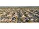 Aerial view of neighborhood with houses and solar panels at 1976 S 172Nd Ln, Goodyear, AZ 85338