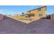 Large backyard with putting green and covered patio at 1976 S 172Nd Ln, Goodyear, AZ 85338