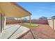 Covered patio overlooks putting green and spacious backyard at 1976 S 172Nd Ln, Goodyear, AZ 85338