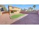 Backyard features a putting green and covered patio area at 1976 S 172Nd Ln, Goodyear, AZ 85338