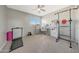 Home office features a treadmill, desk, and wall-mounted exercise equipment at 1976 S 172Nd Ln, Goodyear, AZ 85338