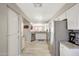 Spacious kitchen with white cabinets, granite counters, and stainless steel appliances at 1976 S 172Nd Ln, Goodyear, AZ 85338