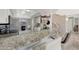 Kitchen with granite breakfast bar and stainless steel appliances at 1976 S 172Nd Ln, Goodyear, AZ 85338