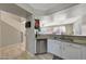 Open kitchen with granite countertops and stainless steel appliances at 1976 S 172Nd Ln, Goodyear, AZ 85338