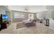 Bright living room with tile floors, sofa, and dining area at 1976 S 172Nd Ln, Goodyear, AZ 85338