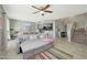 Open living room and kitchen with tile floors and stairs at 1976 S 172Nd Ln, Goodyear, AZ 85338