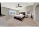 Spacious main bedroom with a large bed and plenty of natural light at 1976 S 172Nd Ln, Goodyear, AZ 85338