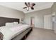 Main bedroom with king-size bed, ensuite access, and large mirror at 1976 S 172Nd Ln, Goodyear, AZ 85338