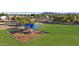 Aerial view of a community playground with play structures at 1976 S 172Nd Ln, Goodyear, AZ 85338