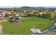 Community playground with play structures and shaded area at 1976 S 172Nd Ln, Goodyear, AZ 85338