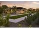 Outdoor bocce ball court with covered seating area at 20518 E Indiana Ave, Queen Creek, AZ 85142