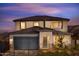 Two-story house with a gray garage door and a landscaped front yard at 20631 N 226Th Ln, Surprise, AZ 85387