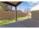 Private backyard with grassy area and patio at 21150 W Prospector Way, Buckeye, AZ 85396