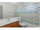 Bathroom with tub shower and striped curtain at 21150 W Prospector Way, Buckeye, AZ 85396