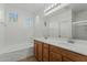 Main bathroom with double vanity and bathtub at 21150 W Prospector Way, Buckeye, AZ 85396