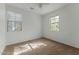 Spacious bedroom with two windows and ceiling fan at 21150 W Prospector Way, Buckeye, AZ 85396