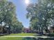 Beautiful community park surrounded by mature trees, with a charming gazebo and green lawns at 21150 W Prospector Way, Buckeye, AZ 85396