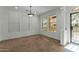 Bright dining area with neutral carpet, window blinds, and a light fixture at 21150 W Prospector Way, Buckeye, AZ 85396