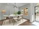 Bright dining area with a modern table and chairs, near entryway at 21150 W Prospector Way, Buckeye, AZ 85396