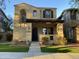 Two-story home with stucco siding, arched entryway, and well-manicured landscaping at 21150 W Prospector Way, Buckeye, AZ 85396