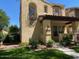 Charming two-story home with well-manicured lawn, front porch, and second story balcony at 21150 W Prospector Way, Buckeye, AZ 85396