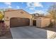 Two-car garage with driveway at 21150 W Prospector Way, Buckeye, AZ 85396