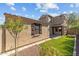 Tan house exterior with landscaping at 21150 W Prospector Way, Buckeye, AZ 85396