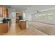 Open concept kitchen with an island, wood cabinets, and granite countertops at 21150 W Prospector Way, Buckeye, AZ 85396