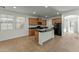 Bright kitchen with an island, wood cabinets, and granite countertops at 21150 W Prospector Way, Buckeye, AZ 85396
