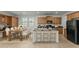 Modern kitchen with island, stainless steel appliances, and ample cabinetry at 21150 W Prospector Way, Buckeye, AZ 85396